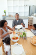 © WavebreakMediaMicro - Afro-american family dining together