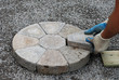 Laying decorative pavers in a circular pattern