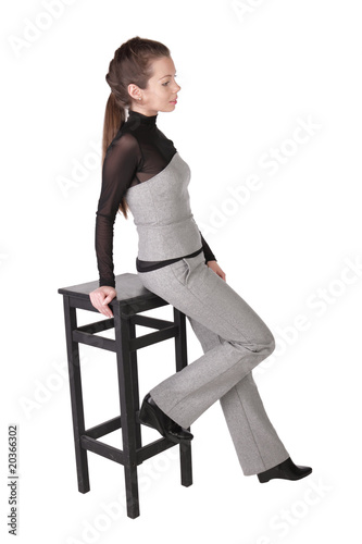 Girl Has Leant The Elbows On A Bar Chair Isolated On White