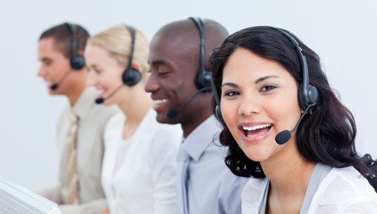 A diverse business team talking on headset