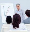 © WavebreakMediaMicro - Mature businessman doing a presentation