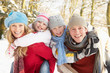 © Monkey Business - Family Having Fun Snowy Woodland
