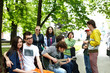 © Gennadiy Poznyakov - Group of people on bench in park. Outdoor.