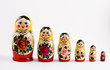 six matryoshka dolls on a white background