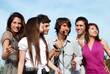 © Andriy Petrenko - Group of young guys and girls having fun on the nature