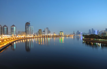 Fototapete - Cityscape of Sharjah City at night. United Arab Emirates