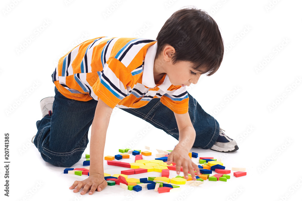 Cute kid inprocess of joining the blocks Stock Photo | Adobe Stock