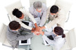 © WavebreakMediaMicro - Cheerful international business people with hands together