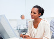 © WavebreakMediaMicro - Concentrated businesswoman working at a computer