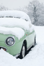 Little Green Car Buried In A Snowdrift