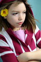 Wall Mural - upset girl showing yellow flower