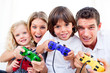 © WavebreakMediaMicro - Animated family playing video game