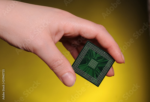 Fotografie, Obraz Microelectronics concept. Female hand holdig chip