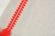 Linen pattern with red embroidery, close-up