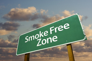 Wall Mural - Smoke Free Zone Green Road Sign and Clouds