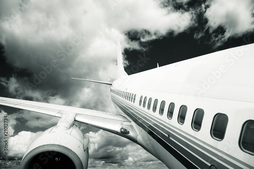 Fototapeta dla dzieci the airplane with the blue sky background.