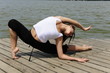 flexible woman stretching outdoors