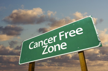 Wall Mural - Cancer Free Zone Green Road Sign and Clouds