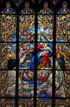 Holy Virgin Mary And Jesus With Rosary On Stained Glass Window