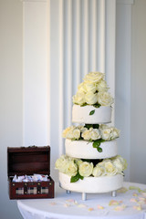 Wall Mural - Big wedding cake and a box full of sweets