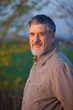© lightpoet - Portrait of a handsome senior man standing outdoors in warm even