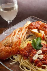 Sticker - lobster linguine with tomato sauce and glass of wine