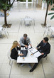 © MDBPIXS - three businesspeople working outdoors elevated view