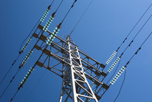 Metal Electric Pole On A Blue Sky Background