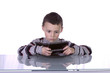 © Mehmet Dilsiz - Little Boy Playing Video Games
