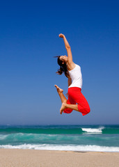 Wall Mural - young woman jumping