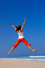 Wall Mural - young woman jumping