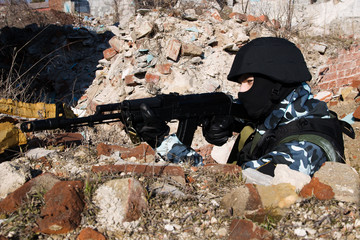 Canvas Print - Soldier shooting from covered position