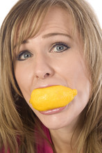 Woman With Lemon In Mouth