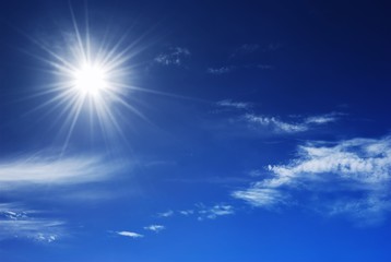 sun shinning in a deep blue sky