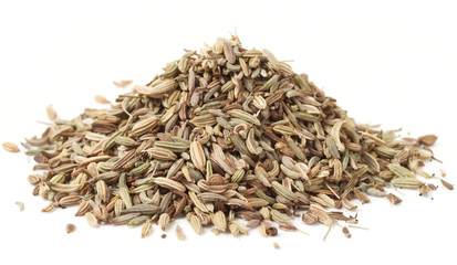 Heap of fennel seeds, macro shot, isolated