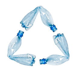 plastic bottles making up recycle symbol