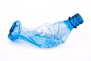 Squashed plastic blue bottle