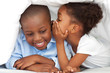 © WavebreakMediaMicro - Ethnic little girl whispering something to her brother