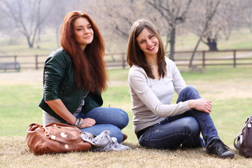 happy young women on field in summer