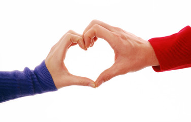 Heart shape symbol with male and female hands