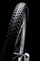 bicycle tyre on black background