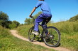 © Pavel Losevsky - back of man wearing sporty clothers. man is riding on bicycle