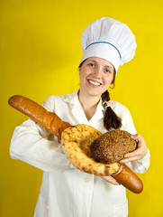 baker with hands full of bread