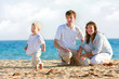 © Alena Yakusheva - happy family on beach