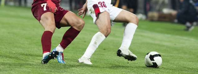 Wall Mural - Soccer players running after the ball