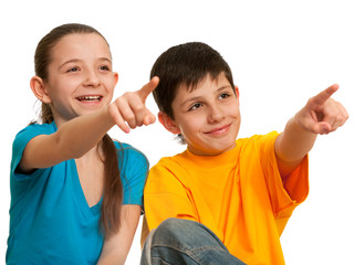 Wall Mural - Smiling children pointing forward