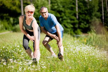 Wall Mural - Senior couple doing sport outdoors