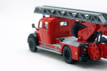 Red Fire Truck Toy Over White Background