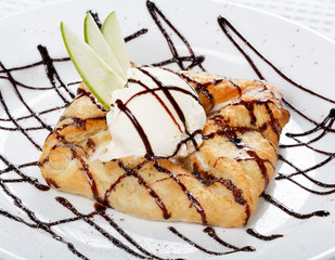 Wall Mural - apple cake and ice-cream on a white plate.