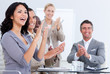 © WavebreakMediaMicro - Cheerful business people applauding in a meeting